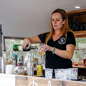 Roadie Mobile Bar - Mary pouring our guest drinks - Bartenders Near Me Roadie Mobile Bar - Mary pouring our guest drinks - Bartenders Near Me