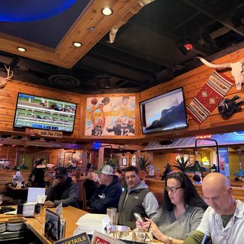 Texas Roadhouse - Local sports legends overlooking the bar - Steakhouses Near Me - Plymouth, Massachusetts Texas Roadhouse - Local sports legends overlooking the bar - Steakhouses Near Me - Plymouth, Massachusetts
