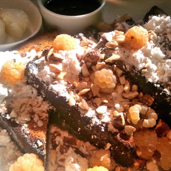 Community Table - Brioche French Toast With Powdered Sugar, Raspberries, and Pecans - New American Near Me - Washington, Connecticut