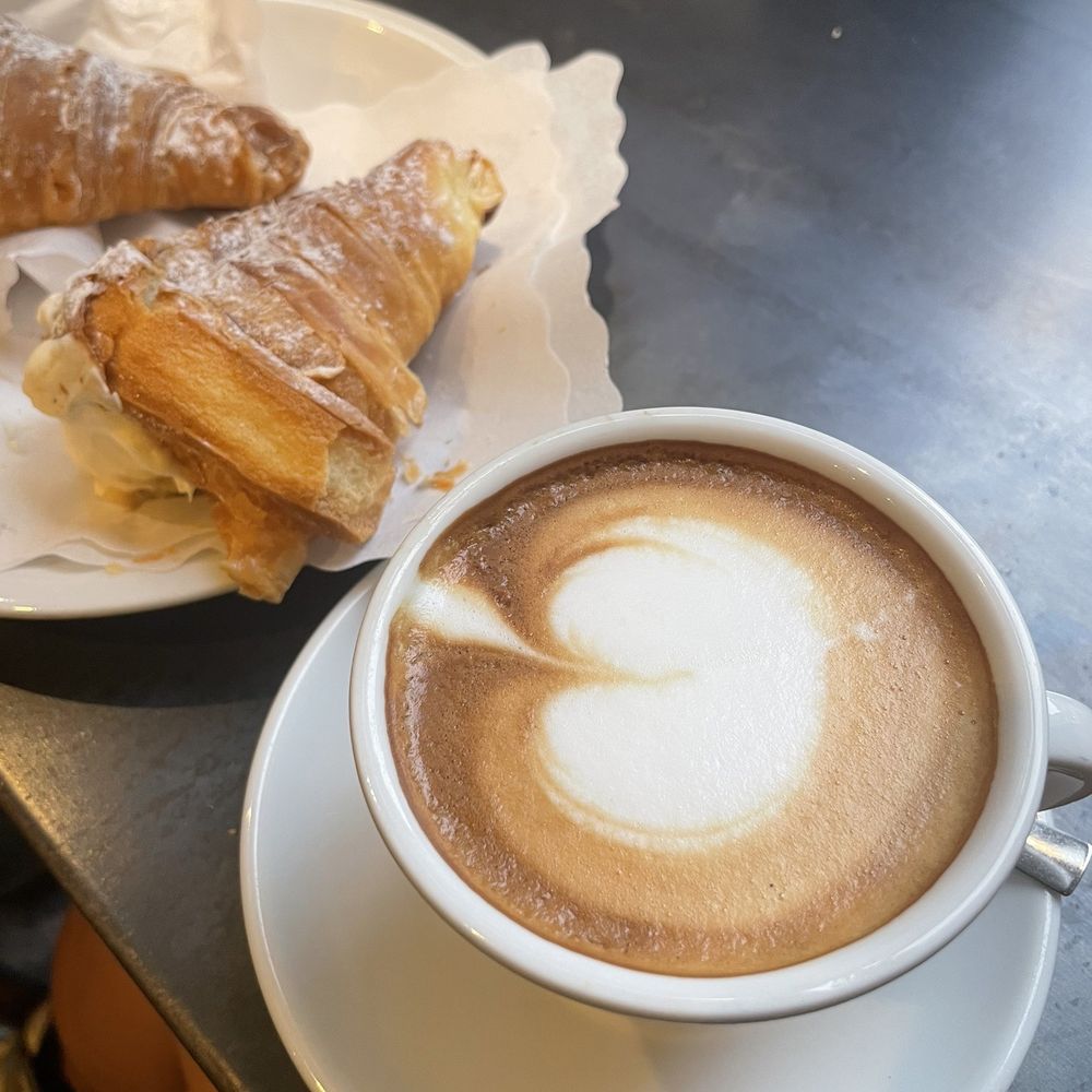Cappuccino and croissant Cappuccino and croissant