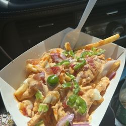 Loaded fries with bacon cheese, chipotle mayo, jalapeños, a little bit of diced purple onion. Very tasty,decent size for the price