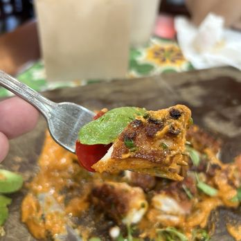 Holbox - A forkful of the pulpo al mojo de Ajo - Latin American Near Me - Los Angeles, California