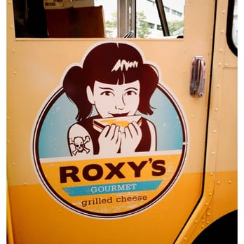 Roxy's Gourmet Grilled Cheese - a woman eating - Sandwiches Near Me Roxy's Gourmet Grilled Cheese - a woman eating - Sandwiches Near Me