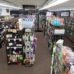 Spirits Plus - Clean and Organized Shelves and Ice Cold Coolers