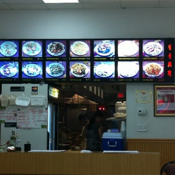Peking Gourmet - a man in a restaurant - Chinese Near Me - Goose Creek, South Carolina Peking Gourmet - a man in a restaurant - Chinese Near Me - Goose Creek, South Carolina