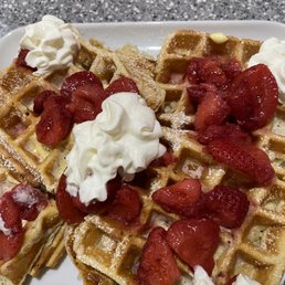 Belgian waffle with strawberry and whipped cream