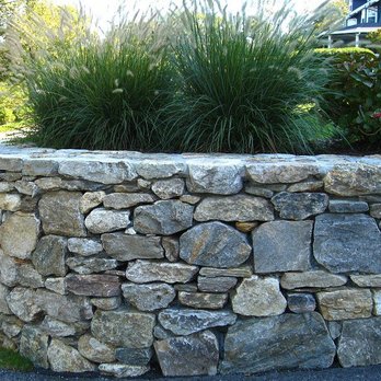Ramirez Landscape Services - a stone retaining wall - Landscaping Near Me