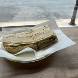 a sandwich on a paper plate