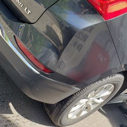 Avis Rent A car System - Scuff marks on bottom of plastic bumper as well as rear quarter panel.