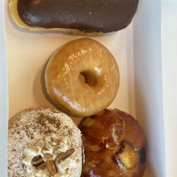 Queen Donuts - Chocolate long John filled with barbarian cream, Glazed Donuts, crème brûlée donut, pumpkin spice, donut - Donuts Near Me - Forney, Texas