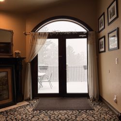 Arrowhead Manor Inn and Event Center - View of the patio on the second floor, for the 3 rooms on the left side of the house. 420 friendly