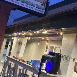 Keke's International Food Spot - Outdoor patio has board games and full tables for dining outside.
