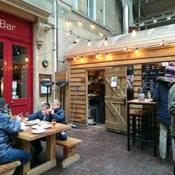 Bath Pizza Co - Outdoor dining under a glass roof