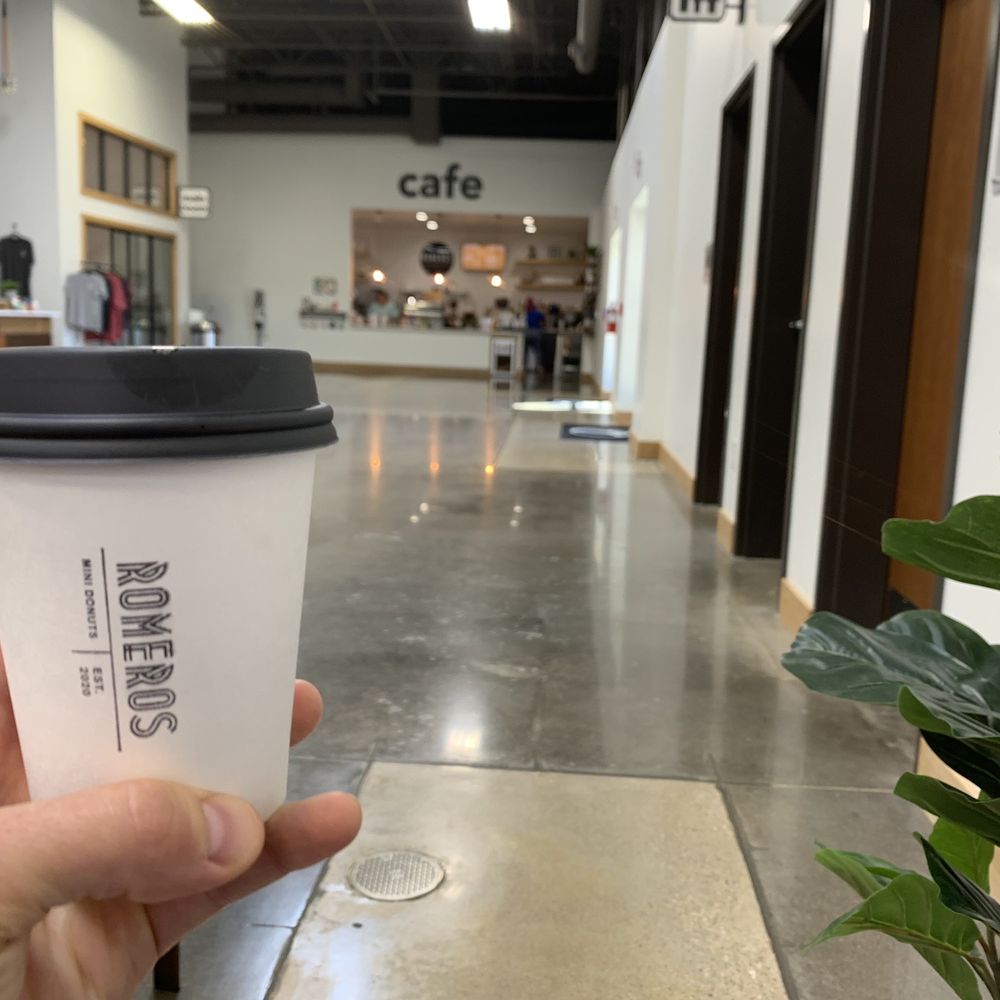 a hand holding a coffee cup a hand holding a coffee cup