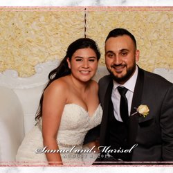 Spotlight Photo Booth - Customized flower wall and customized layouts make your event a one of a kind