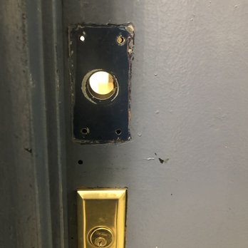 Brick and Galo - The hole in the front door we arrived to, which the broker told us wasn't a big deal. - Real Estate Services Near Me - Brooklyn, New York