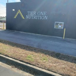 Exterior outside entrance of Tier One Nutrition - Side view of business. Offers drive-thru. - Savannah, Georgia Exterior outside entrance of Tier One Nutrition - Side view of business. Offers drive-thru. - Savannah, Georgia