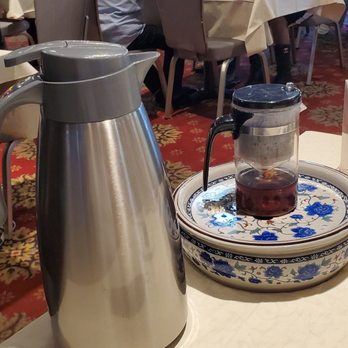 Oriental Tea House - L - Thermos of reserve hot water; R - 2 - piece Teapot with tea leaves chamber on top section. - Dim Sum Near Me - San Leandro, California Oriental Tea House - L - Thermos of reserve hot water; R - 2 - piece Teapot with tea leaves chamber on top section. - Dim Sum Near Me - San Leandro, California