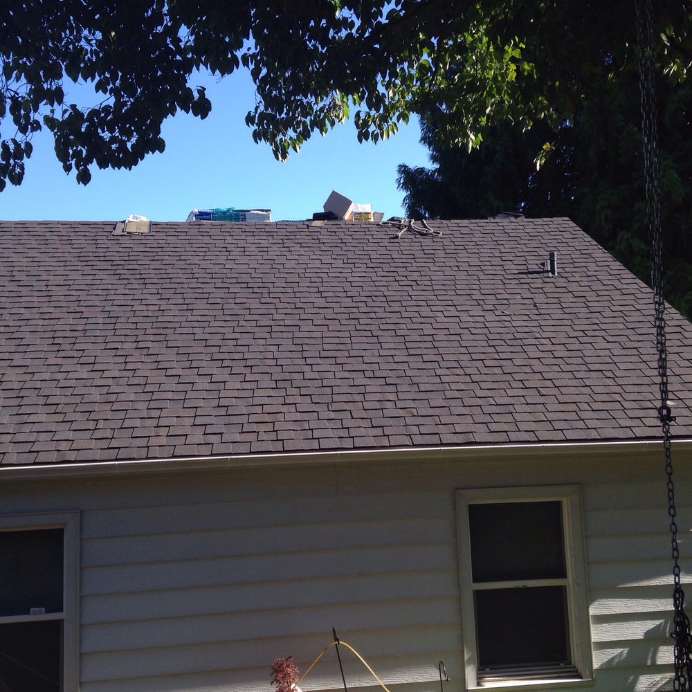 Tekline Roofing - Mid-way through the installation of the triple layered Certainteed Landmark TL in Black Walnut. - Roofing Near Me - Seattle, Washington