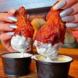 Dog Haus - WINGS - crispy fried wings available plain or tossed in haus buffalo, haus bbq, chipotle honey, or nashville hot style