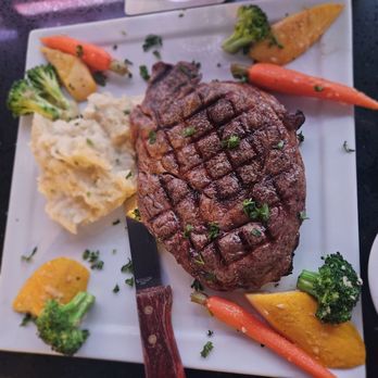 Tonys Grill & Bar - Ribeye 12 oz. (served with a side of mashed potatoes and sauteed vegetables), $36.99 - Cocktail Bars Near Me - Palm Springs, California Tonys Grill & Bar - Ribeye 12 oz. (served with a side of mashed potatoes and sauteed vegetables), $36.99 - Cocktail Bars Near Me - Palm Springs, California