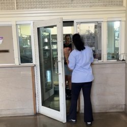 US Post Office - "Supervisor Davis" in a plain blue shirt, no name tag, no "USPS" designation on her shirt, talking about me to  her coworker