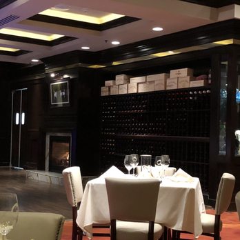 Opus Bistro & Steakhouse - Fireplace and wine cabinets - New American Near Me - League City, Texas
