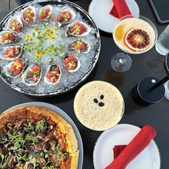 Rise Rooftop Lounge - San Marzano pizza, Dozen oysters (comes with watermelon slush), espresso martini - Lounges Near Me - Anaheim, California