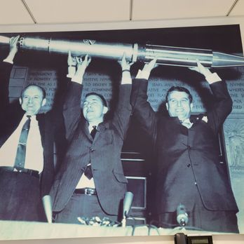NASA Goddard Space Flight Center - dudes holding up the Goddard rocket - Public Services & Government Near Me - Greenbelt, Maryland
