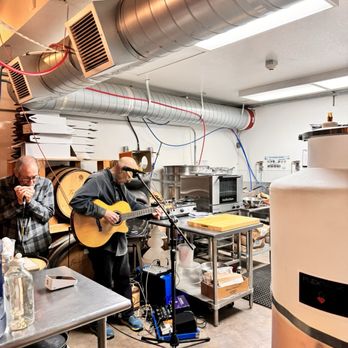 Central Coast Distillery - a man playing a guitar - Distilleries Near Me - Atascadero, California