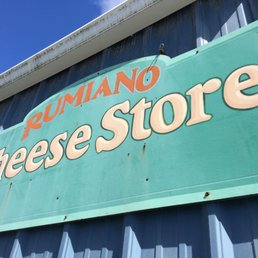 a sign for a cheese store a sign for a cheese store