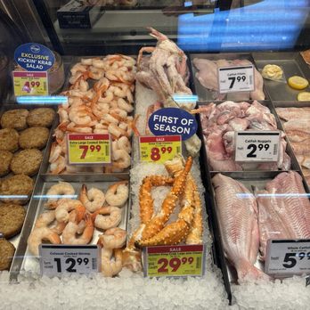 Kroger - Meat counter - A seafood display case at a grocery store features shrimp, crab legs, fish fillets, and other seafood items with price tags. - Grocery Near Me - Greenfield, Indiana