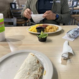 a man eating a burrito a man eating a burrito