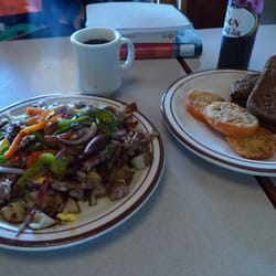 New Moon Cooperative Cafe - Elkhart Scramble with Fried Tomatoes and Dark Rye Toast.