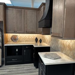 RPI Kitchen and Bath - Procraft Cabinetry in Espresso and Nutmeg. Pompeii Quartz Mistero Gold Jefferey Alexander Cabinet Hardware and Elysium Glass Tile.