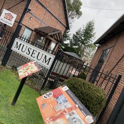 Qualicum Beach Historical & Museum Society - Entrance to museum with parking lot directly beside the gate entrance & forested walk along the rail tracks