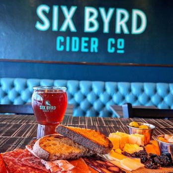 Six Byrd Cider - a platter of food and a glass of beer - Cideries Near Me - Phoenix, Arizona Six Byrd Cider - a platter of food and a glass of beer - Cideries Near Me - Phoenix, Arizona