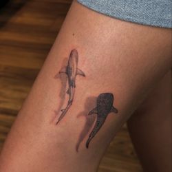 Red Buddha Tattoo - Micro realism tattoos of two sharks!