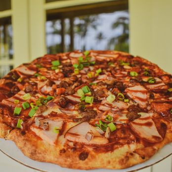 Da Pizza Place - a pizza on a white plate - Pizza Near Me - Waimea, Hawaii Da Pizza Place - a pizza on a white plate - Pizza Near Me - Waimea, Hawaii