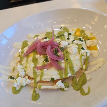 Fount Coffee + Kitchen - Huevos Rancheros...almond flour tortilla,  romesco, pickled onion, goat cheese, 2 over easy eggs, cilantro lime, honeylime yogurt drizzle - Coffee & Tea Near Me - Morrisville, North Carolina