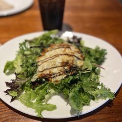 Mellow Mushroom - Stuffed Portobello mushroom over a bed of green with balsamic dressing