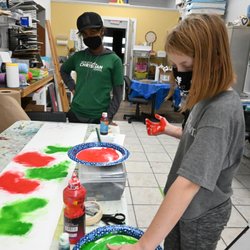 Arts Council of White Lake-Nuveen Center - Open Studio students creating shelf liners for the ACWL-Nuveen front window holiday display.
