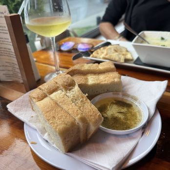 Orapax Restaurant and Bar - Complimentary bread and olive oil dip - Greek Near Me - Norfolk, Virginia Orapax Restaurant and Bar - Complimentary bread and olive oil dip - Greek Near Me - Norfolk, Virginia