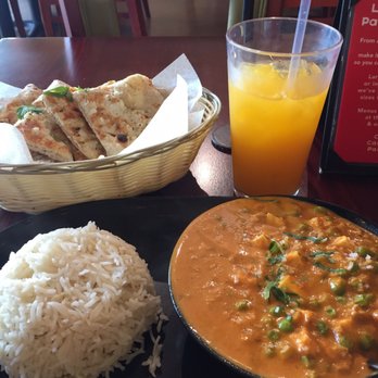 Tarka Indian Kitchen - An order of the mattar paneer, garlic naan, and mango lemonade. - Indian Near Me - San Antonio, Texas