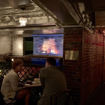 The Beehive - Projection of band at the mezzanine level - American Near Me - Boston, Massachusetts