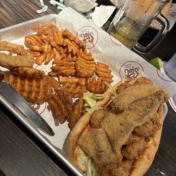 The Spot - Fish (tilapia) and shrimp poboy Generous portion of shrimp. - Burgers Near Me - League City, Texas The Spot - Fish (tilapia) and shrimp poboy Generous portion of shrimp. - Burgers Near Me - League City, Texas