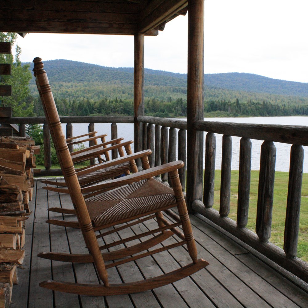 Tim Pond Camps - Relaxing rocking chairs await... - Fishing Near Me - Eustis, Maine