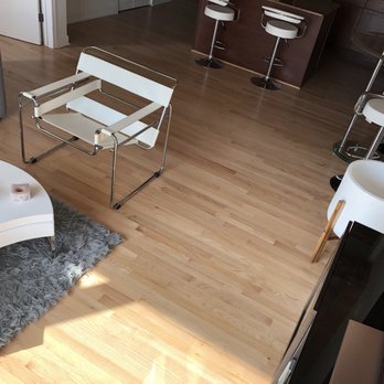 Sophisticated Flooring - a living room and kitchen - Flooring Near Me