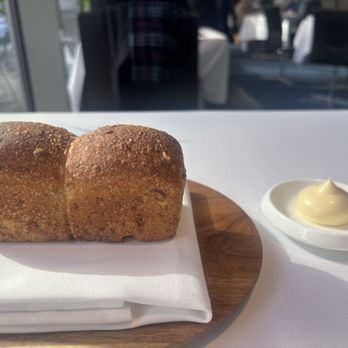 The Modern - Pumpkin seed sourdough with cultured butter - New American Near Me - New York, New York The Modern - Pumpkin seed sourdough with cultured butter - New American Near Me - New York, New York