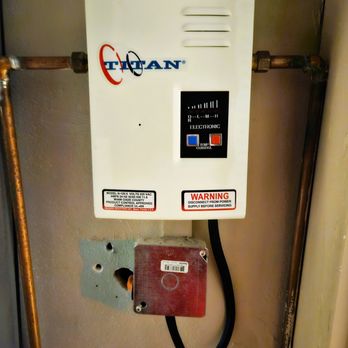 Joe Sanford Plumbing - Before. Old and tired tankless water heating unit. - Plumbing Near Me - Miami, Florida Joe Sanford Plumbing - Before. Old and tired tankless water heating unit. - Plumbing Near Me - Miami, Florida
